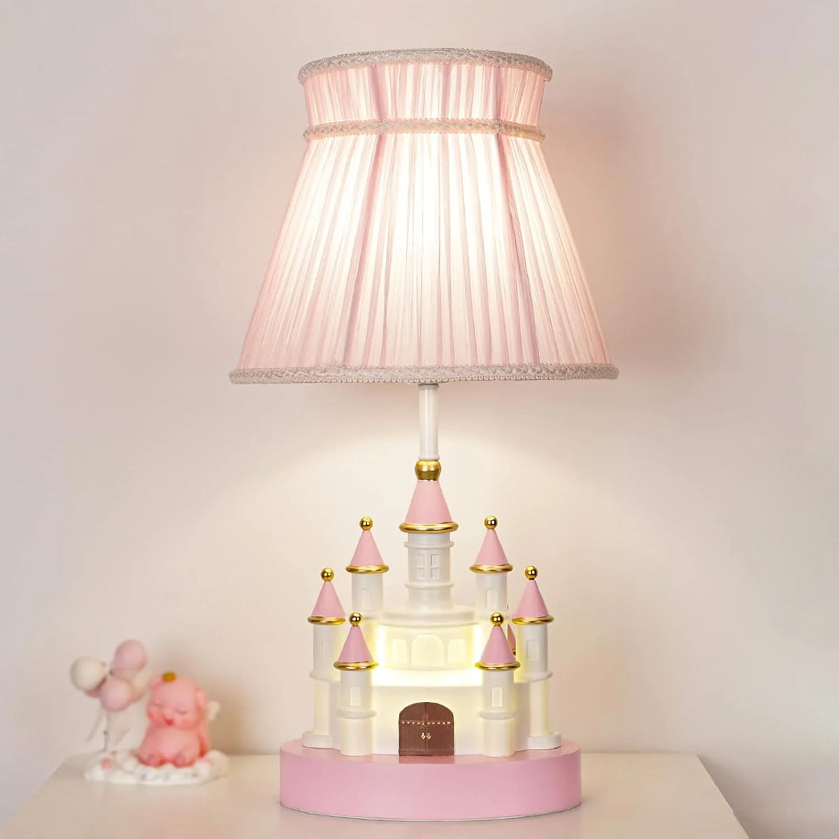 Cartoon children's table. Light pink bedside table. Princess-style cute castle-shaped resin material lamp for girls' bedroom and living room, with fabric shade cover.