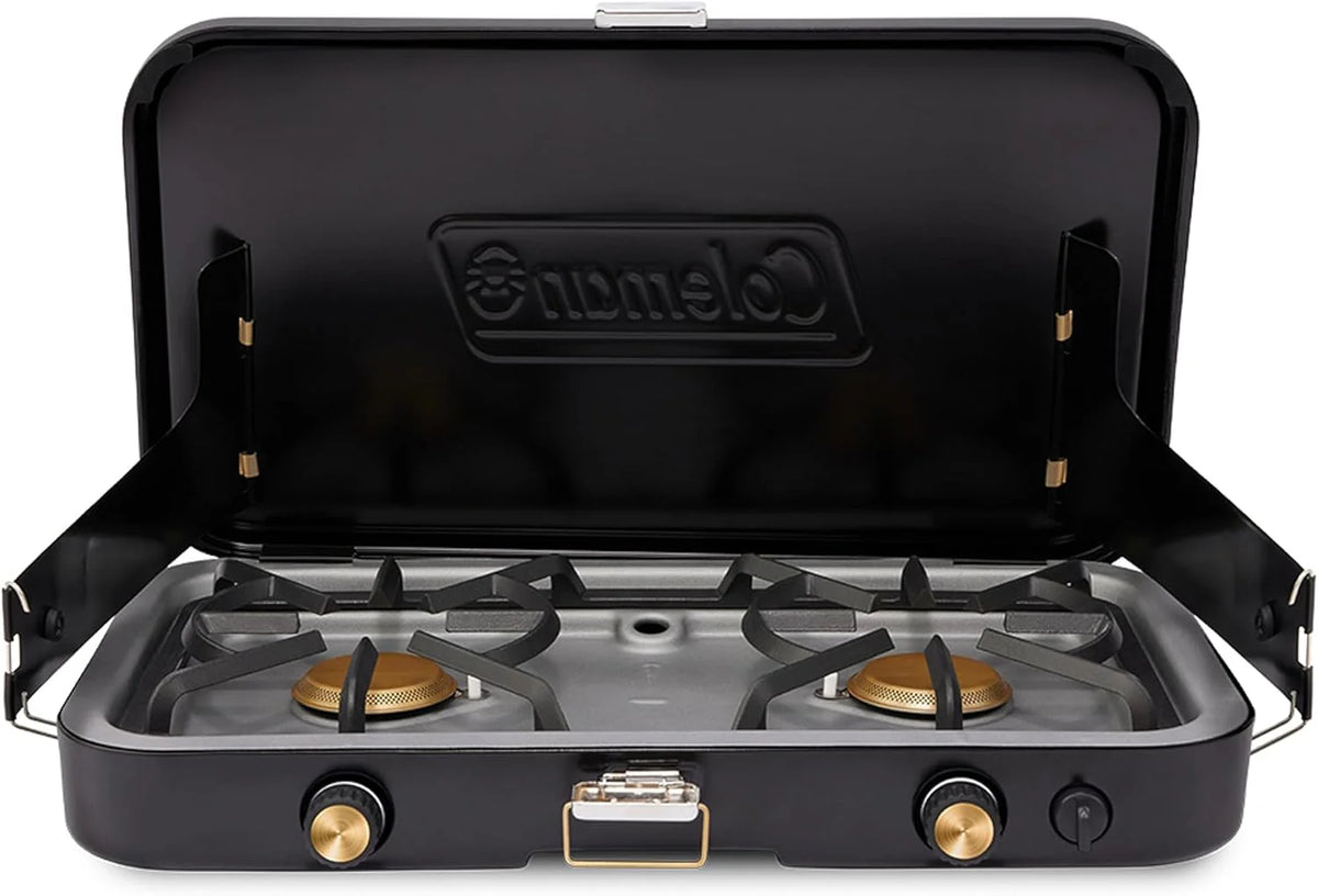 The 1900 series three-in-one propane camping stove, featuring a cast iron grill and frying pan accessories, has a power output of 24000 watts. It is equipped with an adjustable flame cover and excellent lighting device, and comes with two adjustable