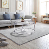 A round coffee table with a metal frame, the surface is made of chrome-plated acrylic glass. image 4