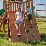 A complete set of wooden mountain-style swings, equipped with a colorful canvas sunshade, a wave slide, a rope swing, a net swing, and a rock wall with climbing ropes and ladders. image 3